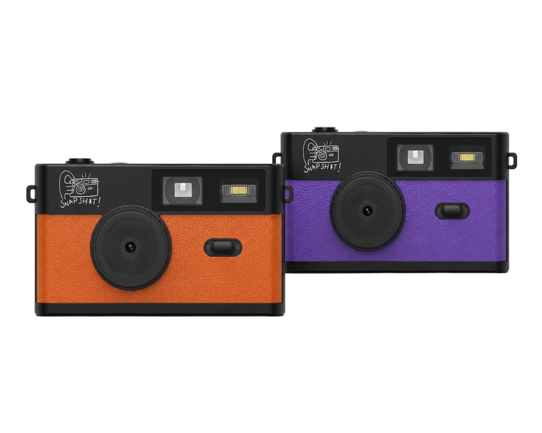 two snpsht cameras in purple and orange